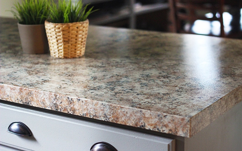 painted countertop with two flower pots sitting on it