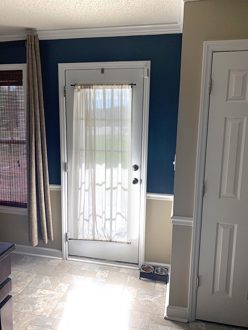 front door with sheer curtain