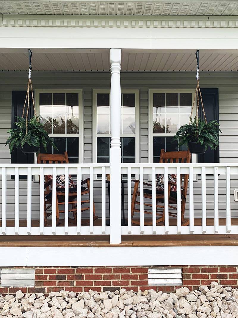 beautiful southern porch with hanging ferns