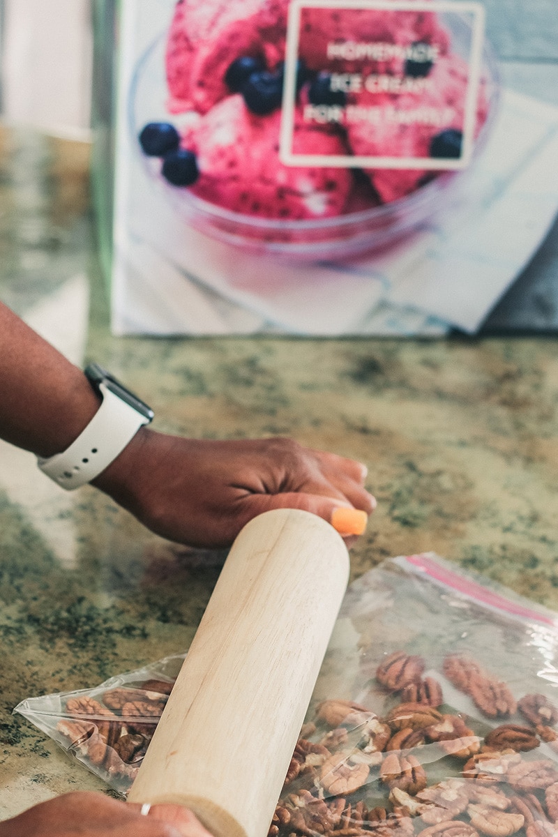 chopped pecans from whole ones with rolling pin