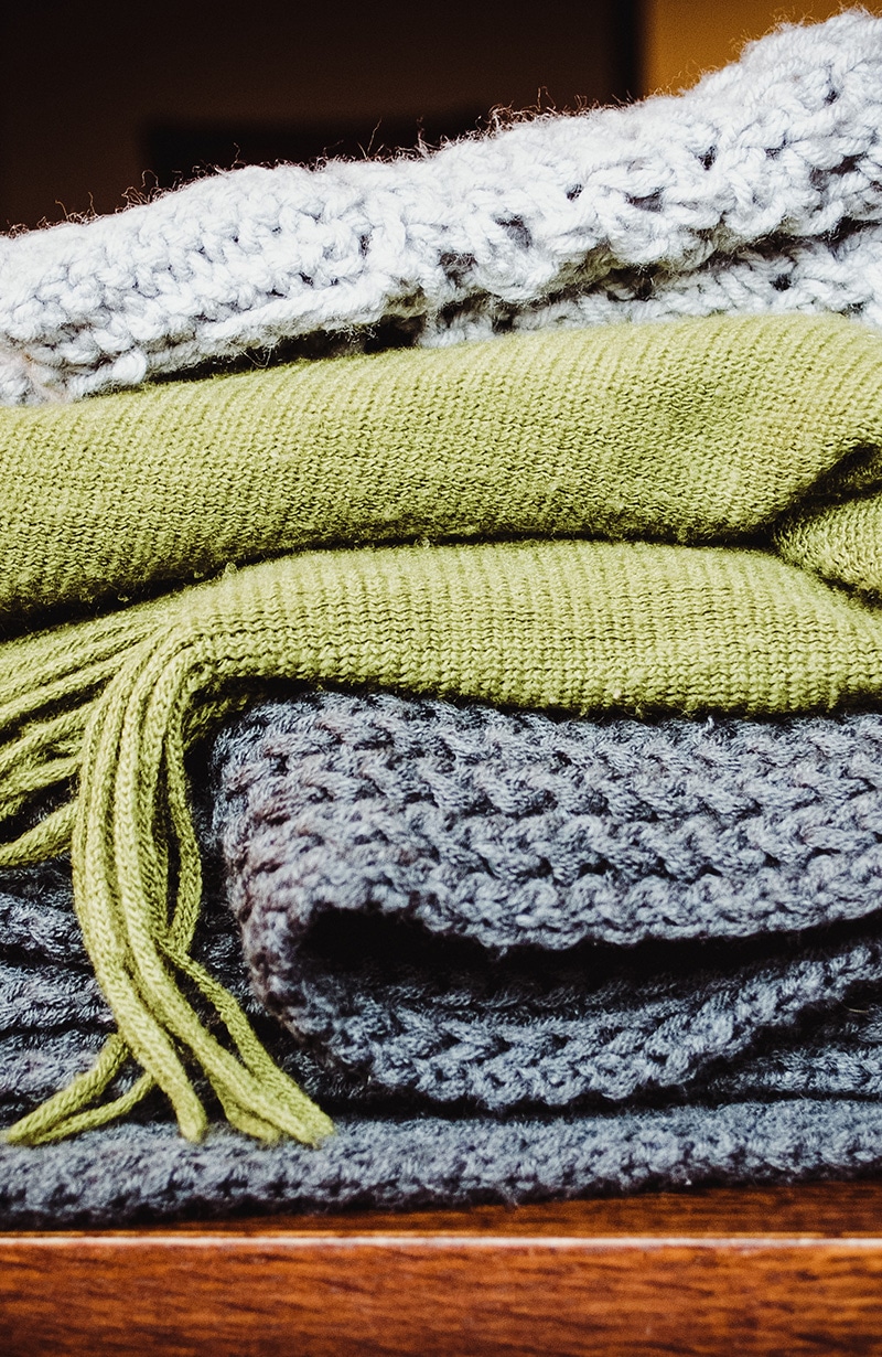 stack of blankets for winter