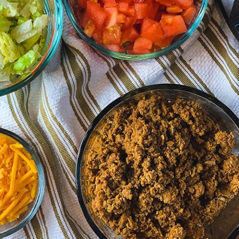taco meat made in the instant pot, shredded cheese, lettuce, tomatoes