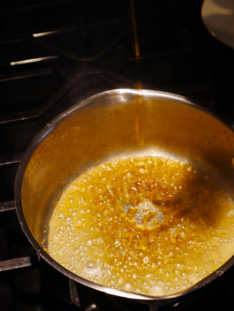 Garlic and melted butter in saucepan