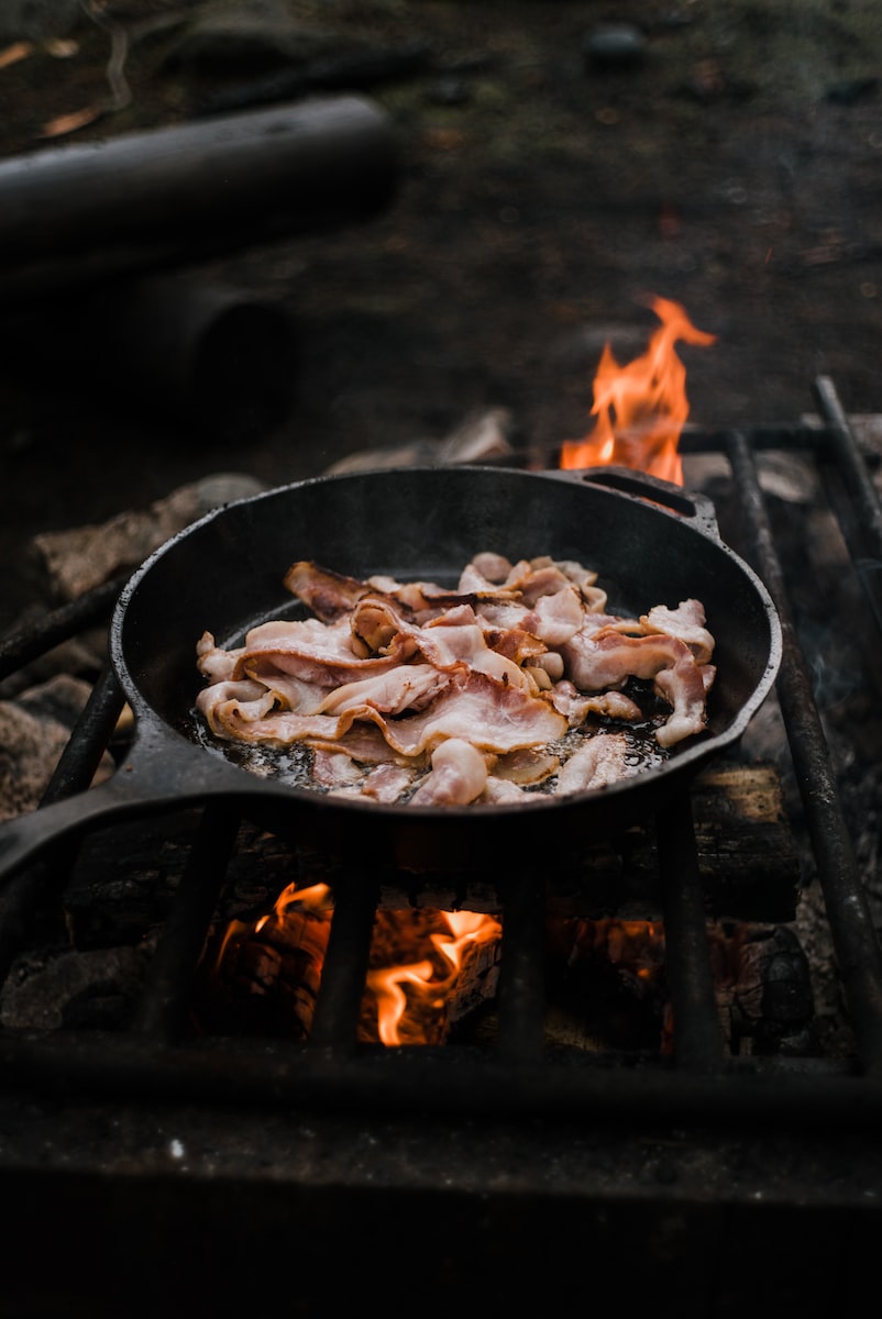 cooking bacon in a skillet