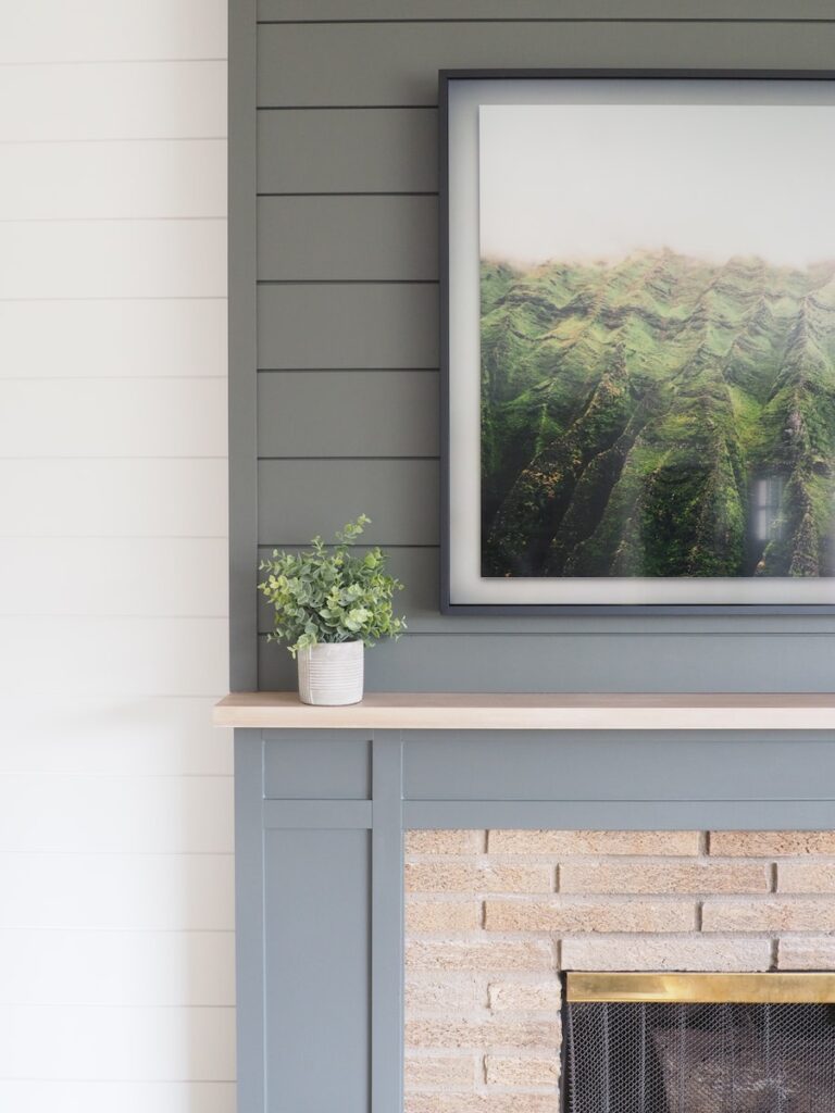 green painted shiplap above fireplace