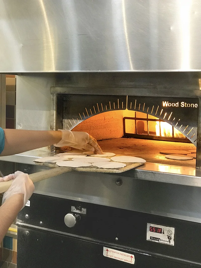 fresh made pita bread in the fire oven at Sassool cafe North Rlaeigh