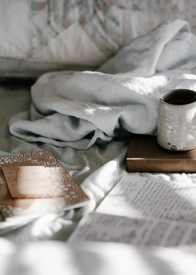 comfortable bed with cup of tea