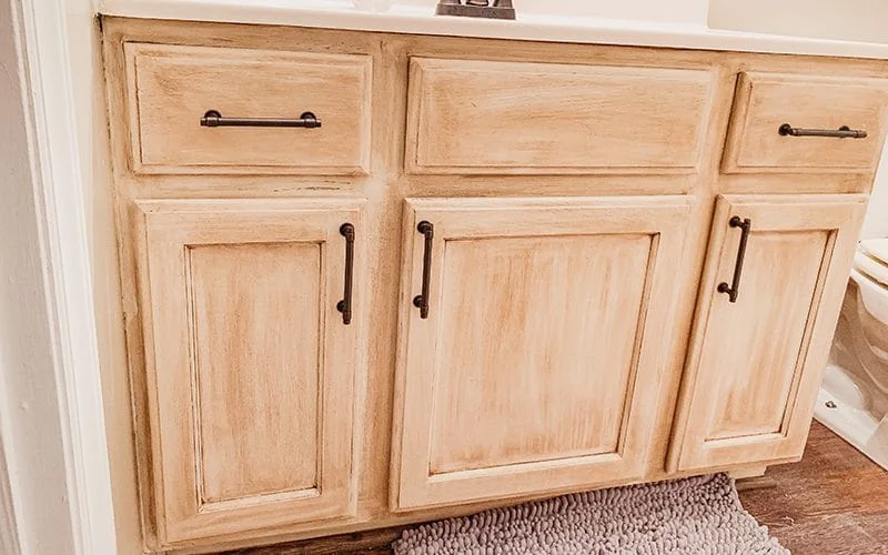 completed vanity update with rustoleum chiffon cream chalk paint and aged bronze glaze