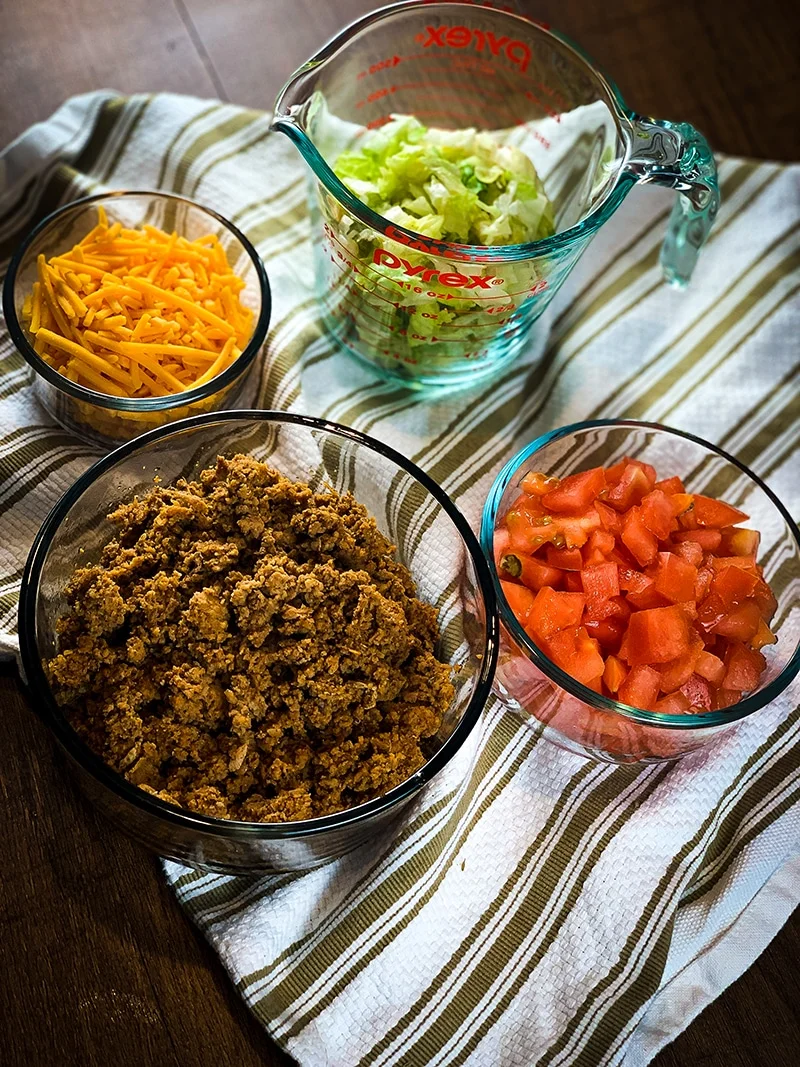instant pot taco meat, shredded cheese, lettuce and tomatoes